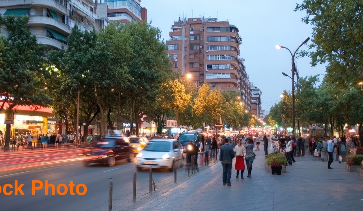 large-vecteezy_bustling-urban-street-scene-with-moving-cars-and-pedestrians_70074596_large