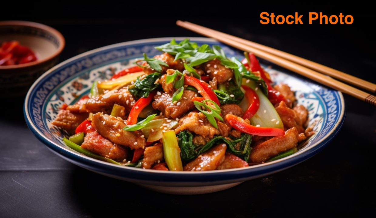 vecteezy_stir-fried-pork-and-vegetables-on-a-plate-with-chopsticks_32947206
