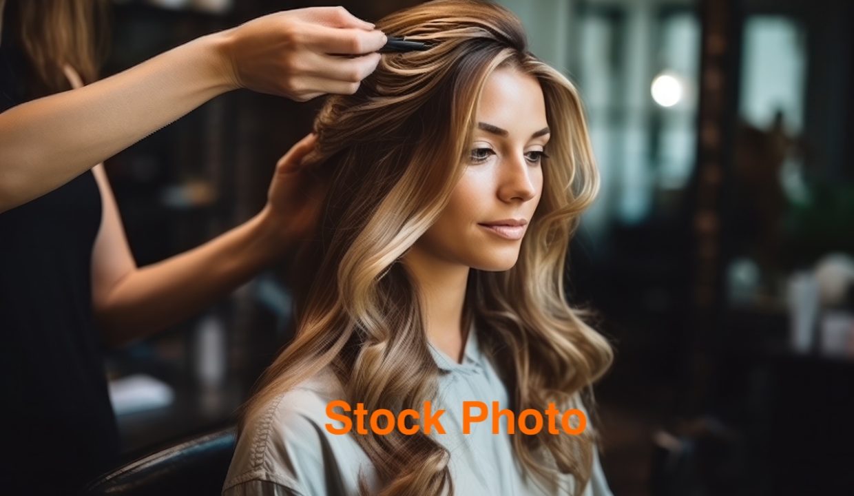 female hair stylist at salon.