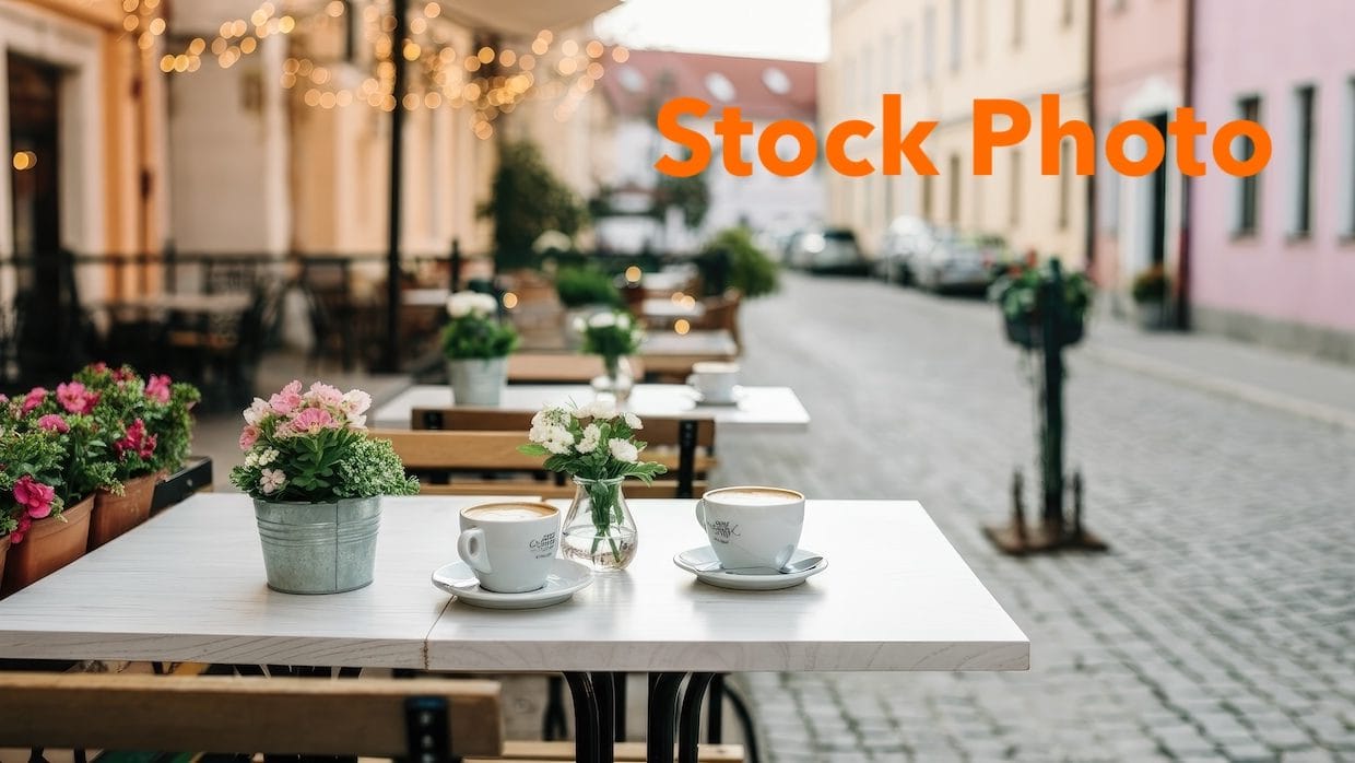 5. vecteezy_cozy-outdoor-cafe-with-flowers-and-cobblestone-street_73752526